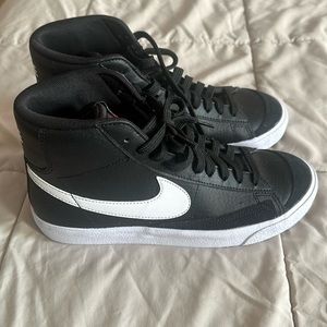 Nike Black and white high top sneakers.  Boys size 6.  Fits a women’s 7.
